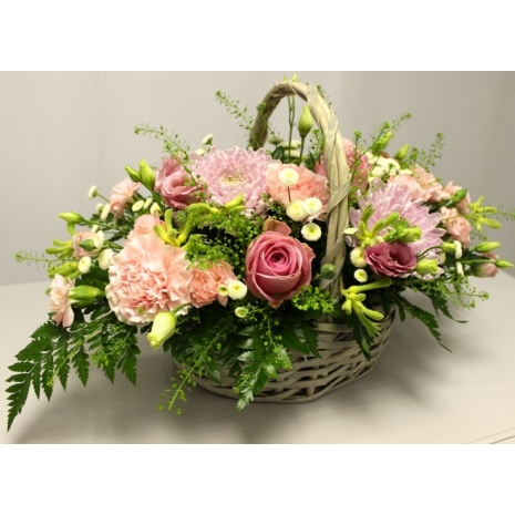 roses and seasonal flowers in basket